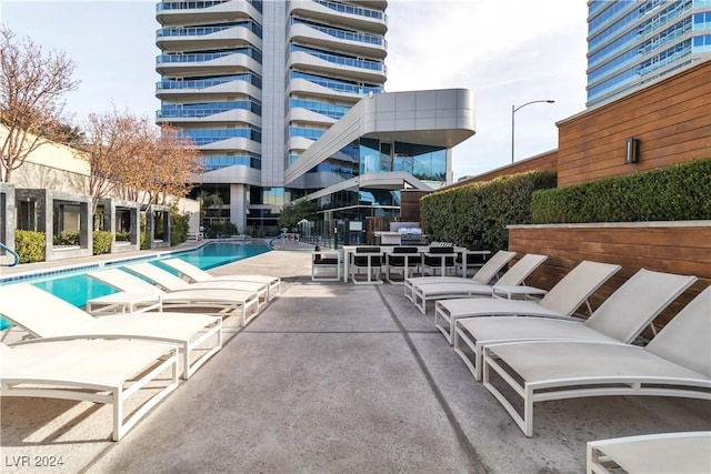 4471 Dean Martin Dr Unit 606, Las Vegas, NV 89103 - community pool with a patio area
