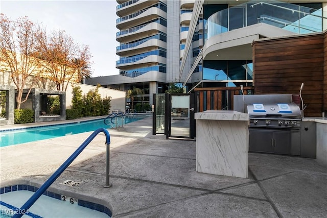 4471 Dean Martin Dr Unit 606, Las Vegas, NV 89103 - community pool with area for grilling and a patio area