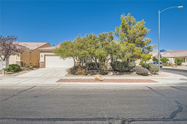 obstructed view of property with a garage