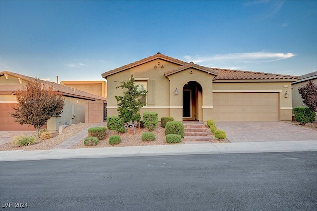 view of front of home with a garage