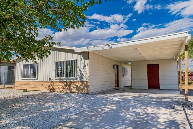 view of front of home featuring a carport