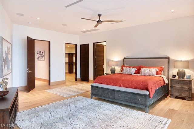 bedroom with ceiling fan and light hardwood / wood-style flooring