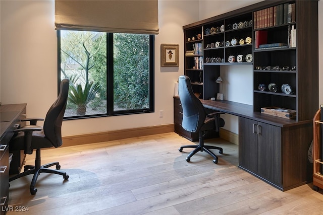 office space with light hardwood / wood-style flooring