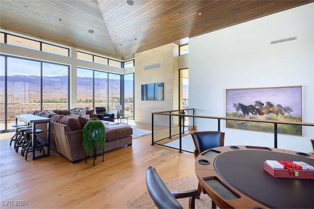 4915 Summit Overlook Dr, Las Vegas, NV 89135 - living area featuring wood ceiling, a mountain view, light wood-type flooring, and a towering ceiling