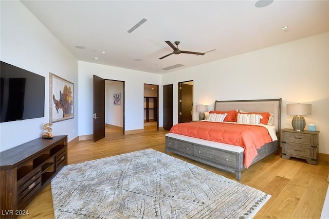 4915 Summit Overlook Dr, Las Vegas, NV 89135 - bedroom with light wood-style floors, baseboards, and ceiling fan