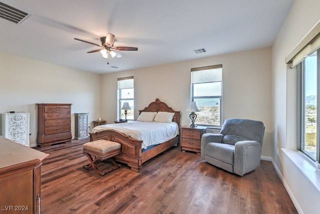 bedroom with ceiling fan and dark wood-type flooring