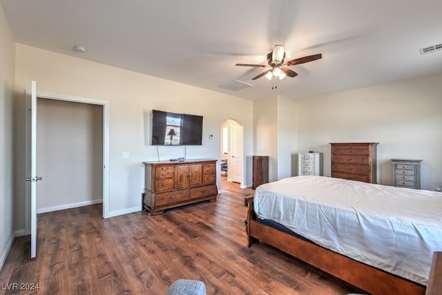 bedroom featuring ceiling fan and dark wood-type flooring