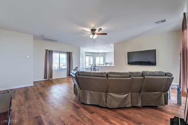 living room with ceiling fan and wood-type flooring