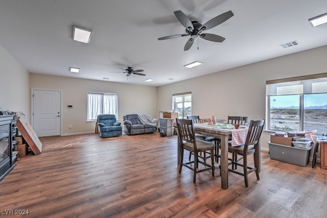 dining area with dark hardwood / wood-style flooring and ceiling fan