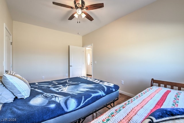 bedroom with hardwood / wood-style flooring and ceiling fan