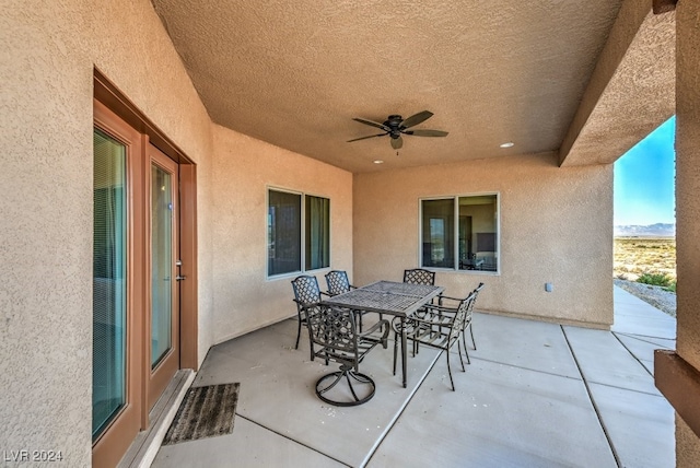 view of patio featuring ceiling fan