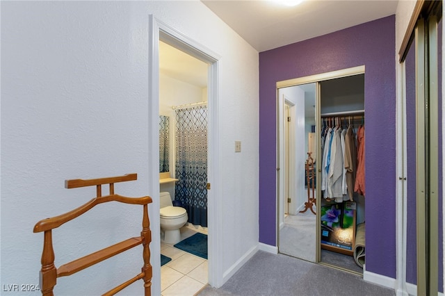 bathroom featuring tile patterned floors and toilet