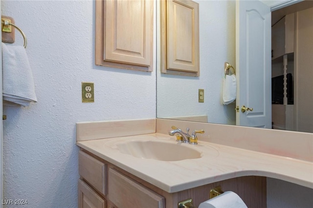 4020 Shadow Wood Ave, Las Vegas, NV 89121 - bathroom featuring vanity and a textured wall