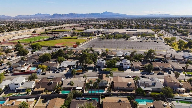 4020 Shadow Wood Ave, Las Vegas, NV 89121 - aerial view of property and surrounding area featuring a pool, a mountain backdrop, and nearby suburban area