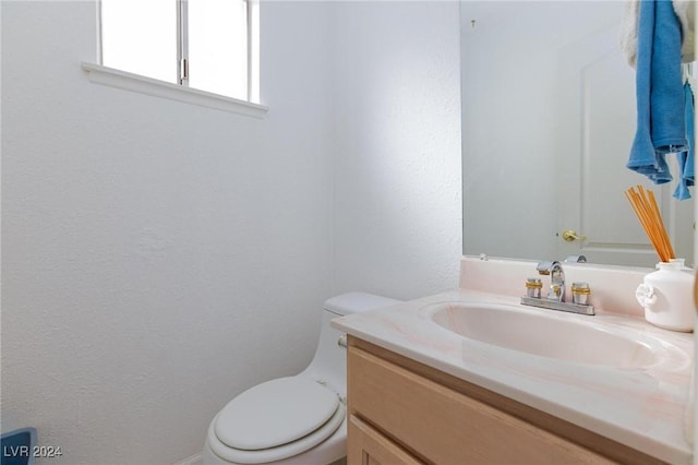 4020 Shadow Wood Ave, Las Vegas, NV 89121 - bathroom with vanity, a textured wall, and toilet