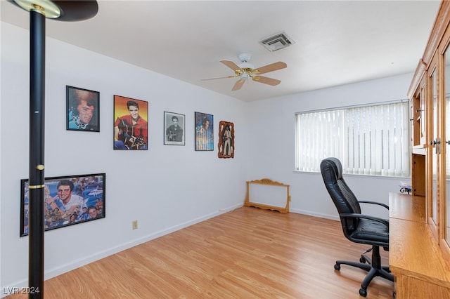 office featuring light hardwood / wood-style floors and ceiling fan