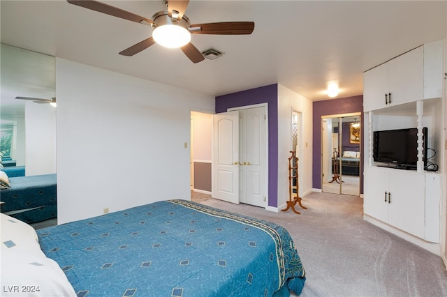 bedroom featuring ceiling fan and light colored carpet