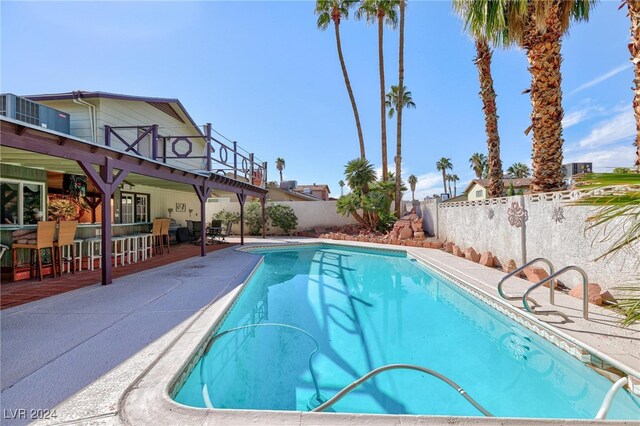 view of swimming pool with a patio