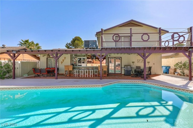 4020 Shadow Wood Ave, Las Vegas, NV 89121 - back of property featuring outdoor dining area, a patio area, and an outdoor pool