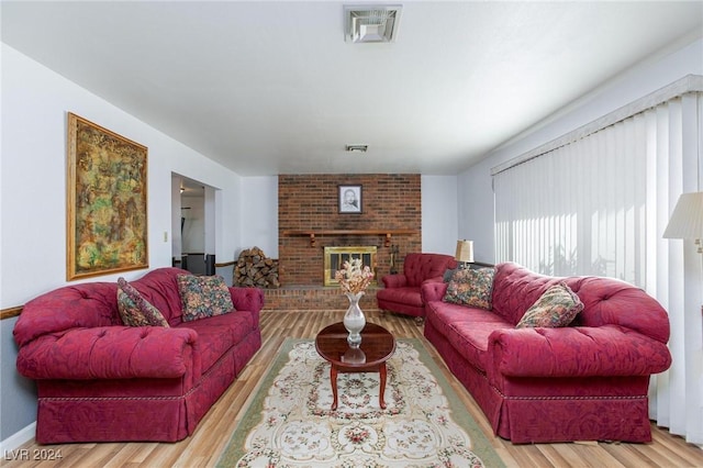 4020 Shadow Wood Ave, Las Vegas, NV 89121 - living room featuring wood finished floors, a fireplace, and baseboards