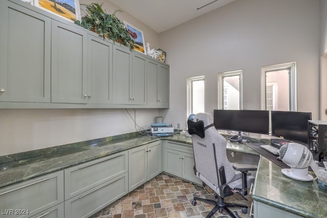 office area with stone finish flooring and plenty of natural light