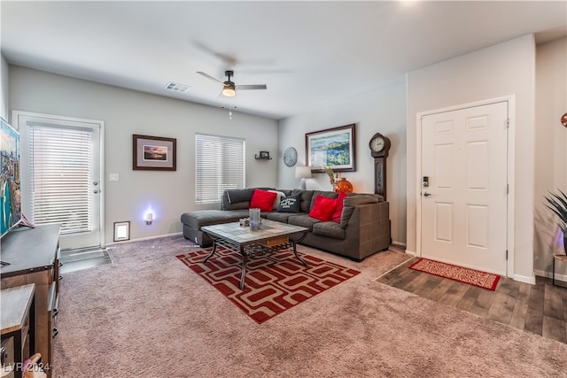 living room featuring ceiling fan, hardwood / wood-style flooring, and a healthy amount of sunlight