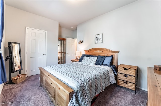 bedroom with dark carpet