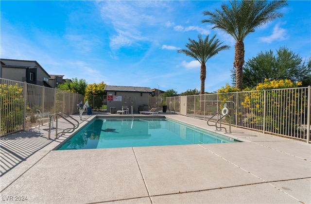 view of swimming pool with a patio