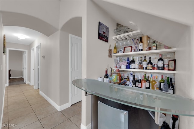 bar featuring tile patterned flooring