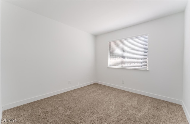 unfurnished room with carpet