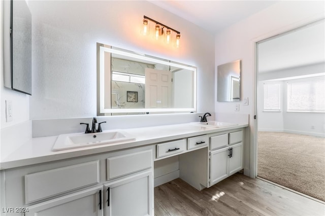 bathroom with vanity and hardwood / wood-style flooring