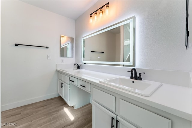 bathroom with wood-type flooring and vanity