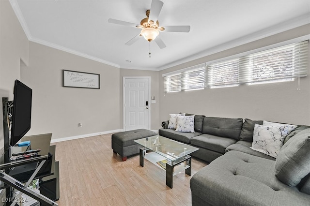 living room featuring ceiling fan, hardwood / wood-style flooring, and ornamental molding