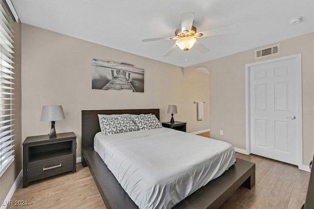 bedroom with ceiling fan and light hardwood / wood-style flooring