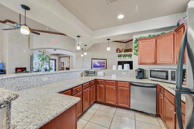 kitchen featuring ceiling fan, light stone countertops, light tile patterned floors, appliances with stainless steel finishes, and kitchen peninsula