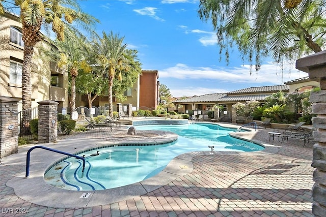 view of swimming pool with a patio area