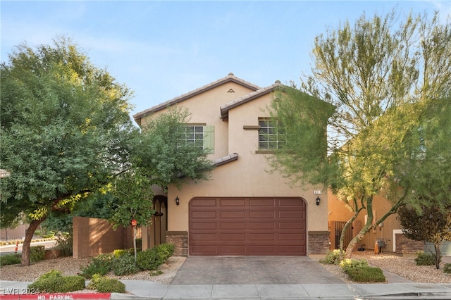 mediterranean / spanish-style house featuring a garage