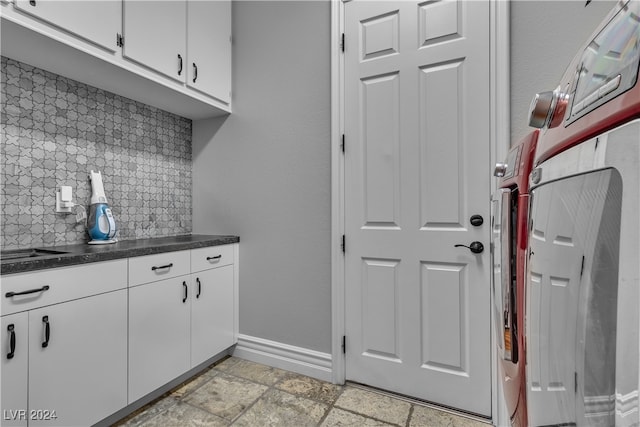 kitchen featuring white cabinets and tasteful backsplash