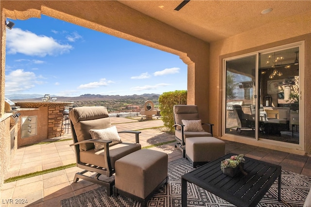 view of patio featuring a mountain view and outdoor lounge area