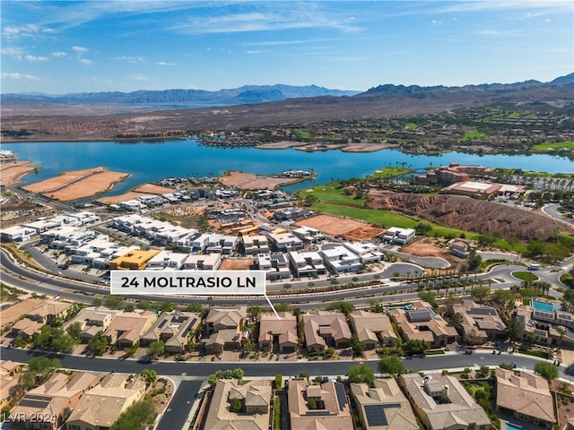 birds eye view of property featuring a water and mountain view