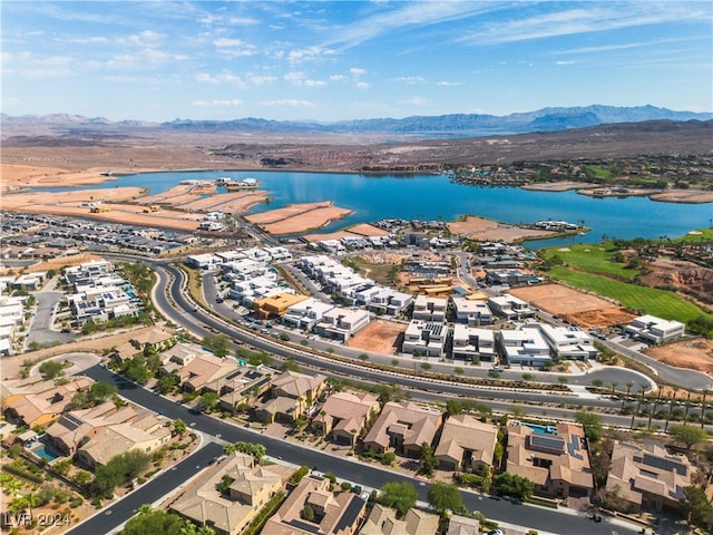 birds eye view of property featuring a water and mountain view