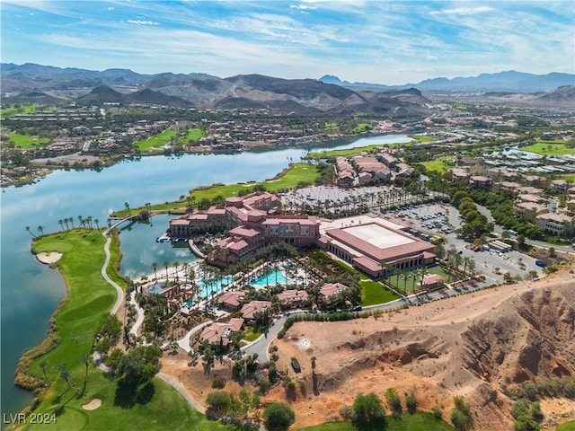 bird's eye view with a water and mountain view