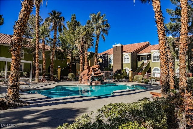 view of swimming pool featuring a patio area