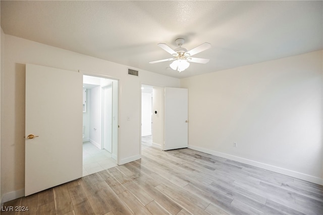 unfurnished room with light hardwood / wood-style floors and ceiling fan