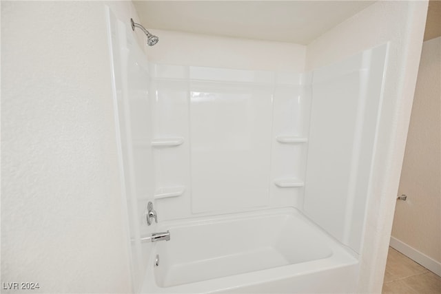 bathroom with shower / washtub combination and tile patterned flooring