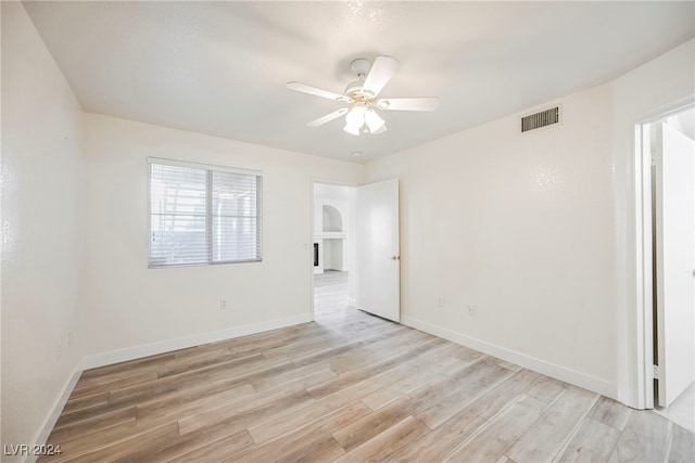 unfurnished room with light hardwood / wood-style flooring and ceiling fan