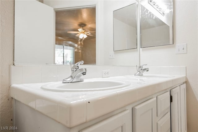 bathroom featuring vanity and ceiling fan