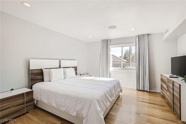 bedroom with light wood-type flooring