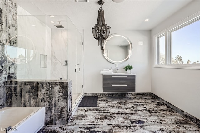 bathroom featuring vanity and shower with separate bathtub