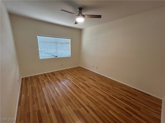 empty room featuring wood-type flooring and ceiling fan